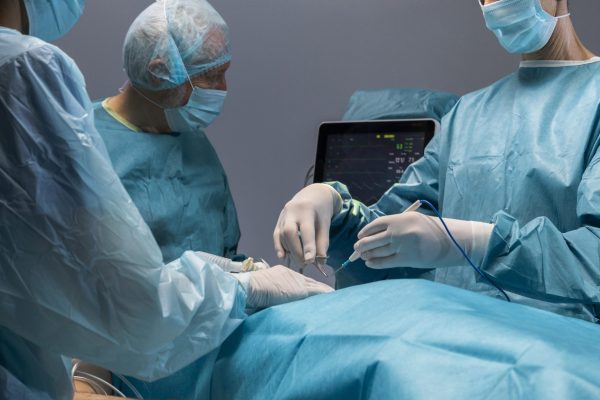 doctors-doing-surgical-procedure-patient hip bone replacement